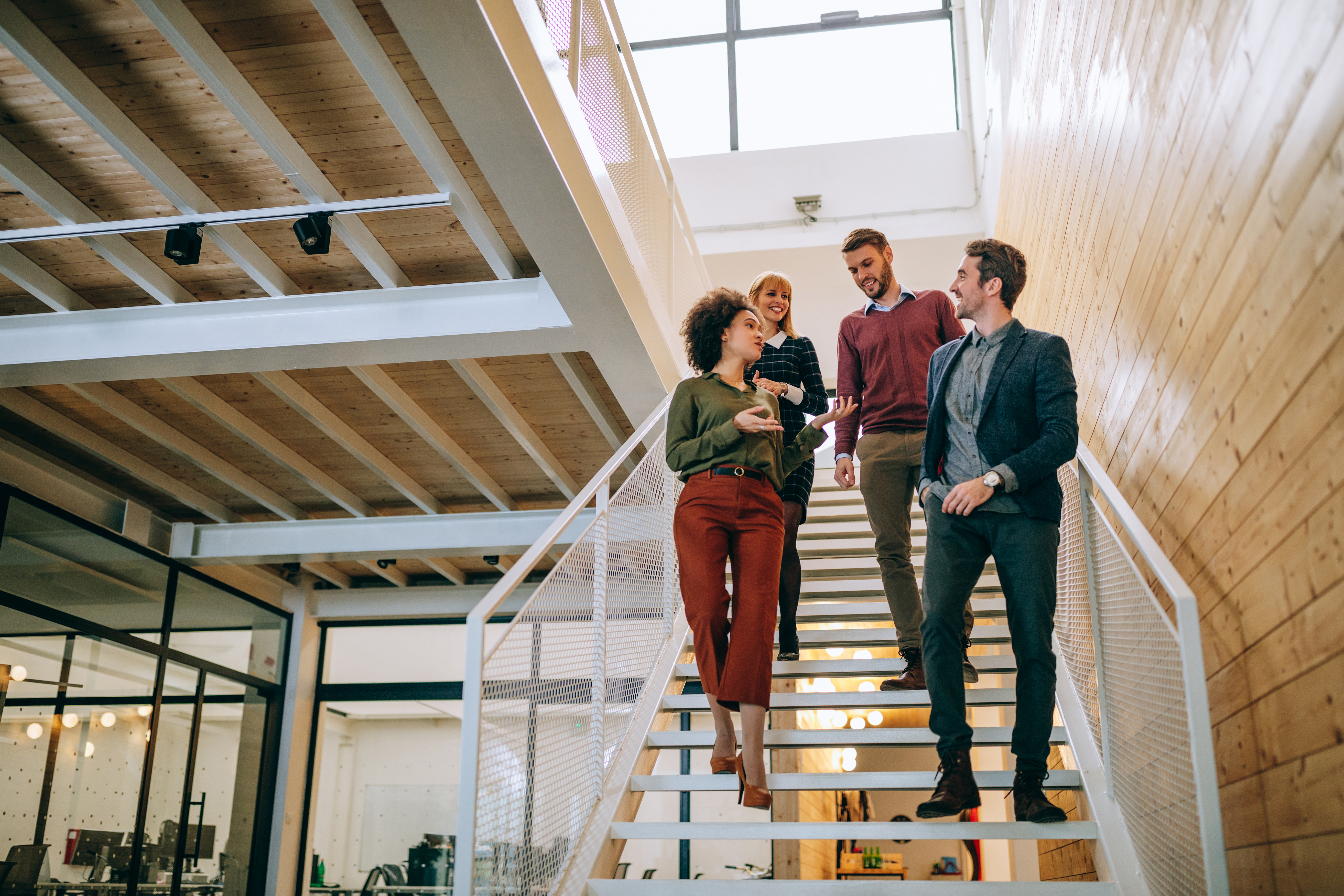 Group of coworkers going down the stairs